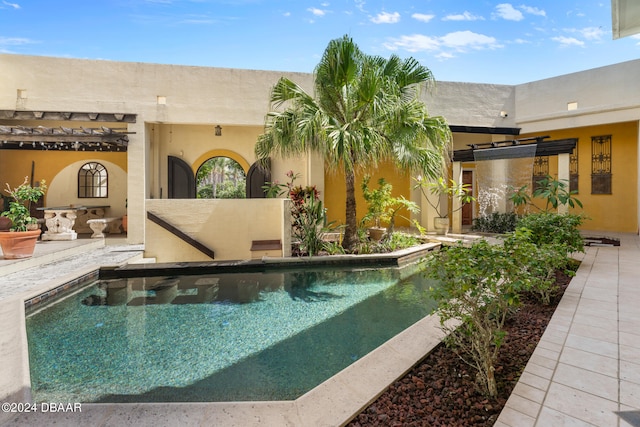 view of pool featuring a patio area