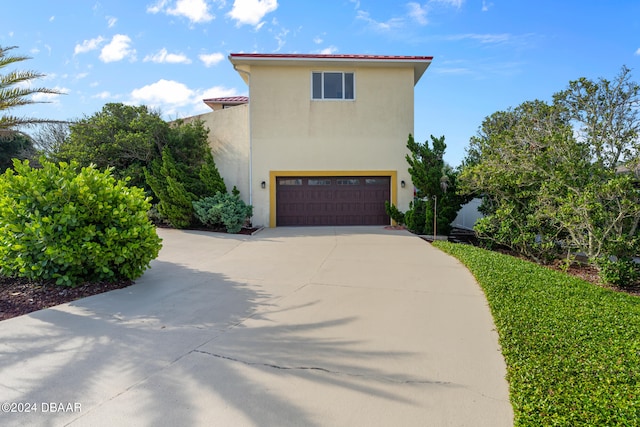 view of property exterior with a garage