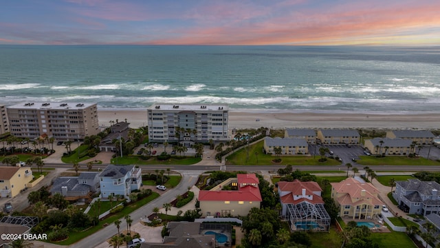 aerial view at dusk with a water view