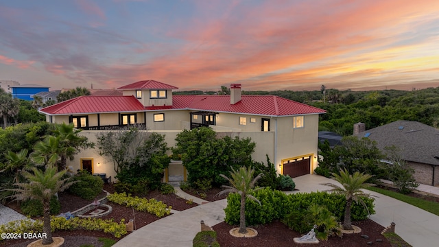 view of front of property with a garage