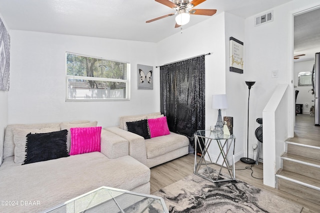 1318 San Jose Blvd, Daytona Beach, FL 32117 - living room with ceiling fan, wood finished floors, and stairway