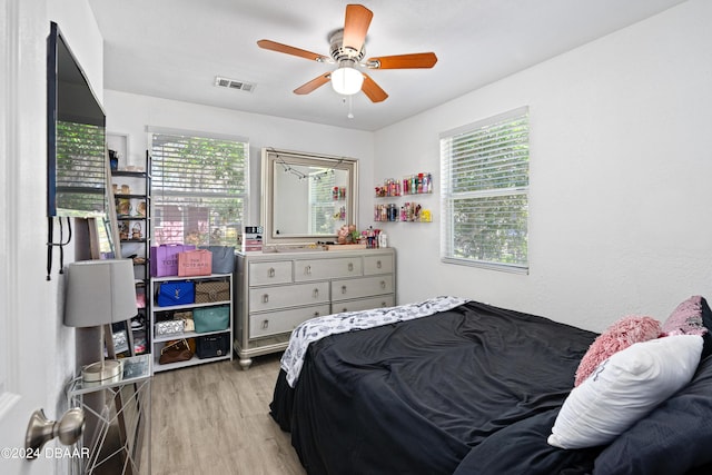 1318 San Jose Blvd, Daytona Beach, FL 32117 - bedroom featuring multiple windows, light wood-style floors, and ceiling fan