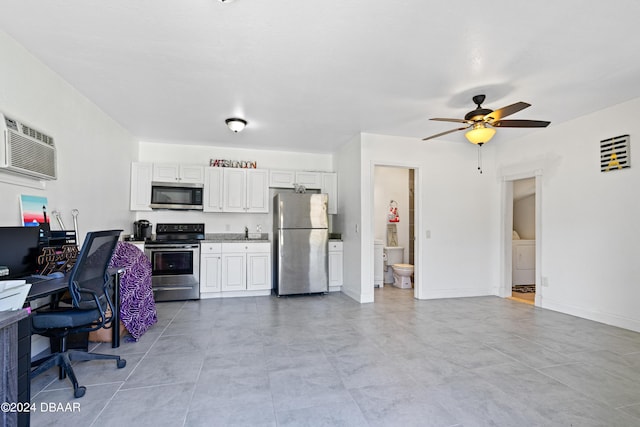 1318 San Jose Blvd, Daytona Beach, FL 32117 - kitchen featuring stainless steel appliances, a ceiling fan, white cabinetry, washer / dryer, and a sink