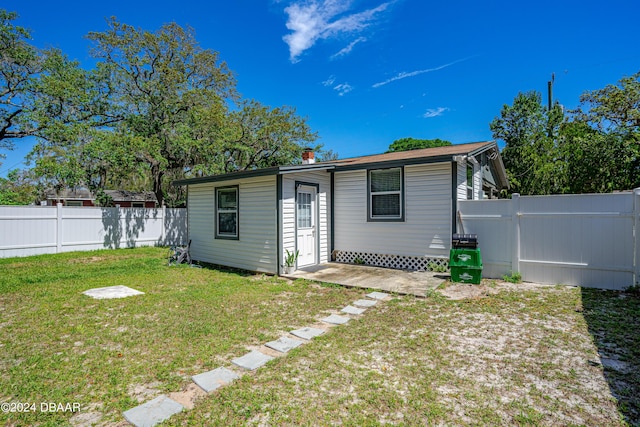 1318 San Jose Blvd, Daytona Beach, FL 32117 - rear view of house featuring a chimney