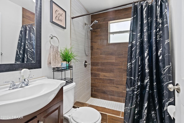 1318 San Jose Blvd, Daytona Beach, FL 32117 - bathroom with toilet, vanity, and a tile shower