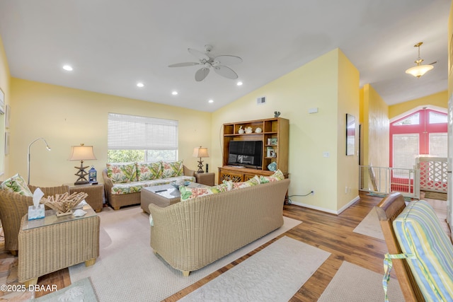 6361 Turtlemound Rd, New Smyrna Beach, FL 32169 - living area featuring visible vents, wood finished floors, recessed lighting, a ceiling fan, and vaulted ceiling