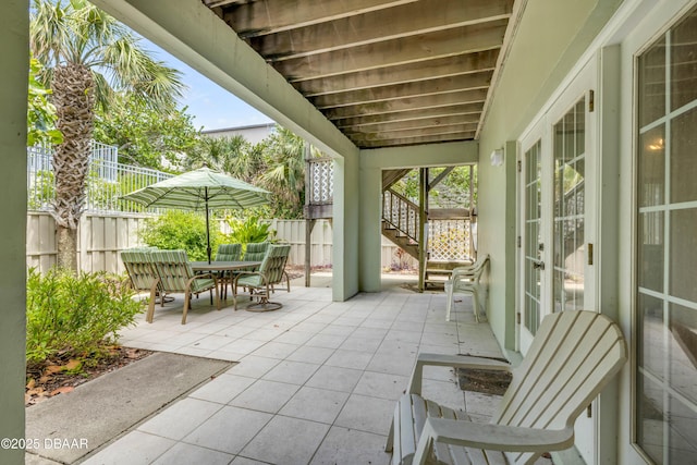6361 Turtlemound Rd, New Smyrna Beach, FL 32169 - sunroom / solarium with french doors and outdoor dining space