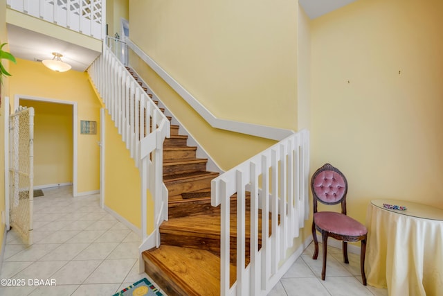 6361 Turtlemound Rd, New Smyrna Beach, FL 32169 - stairs featuring baseboards and tile patterned floors