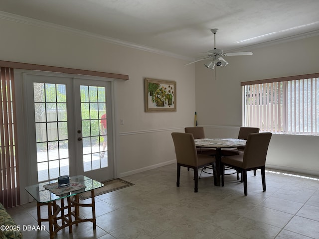 6361 Turtlemound Rd, New Smyrna Beach, FL 32169 - dining space with a ceiling fan, french doors, crown molding, light tile patterned floors, and baseboards