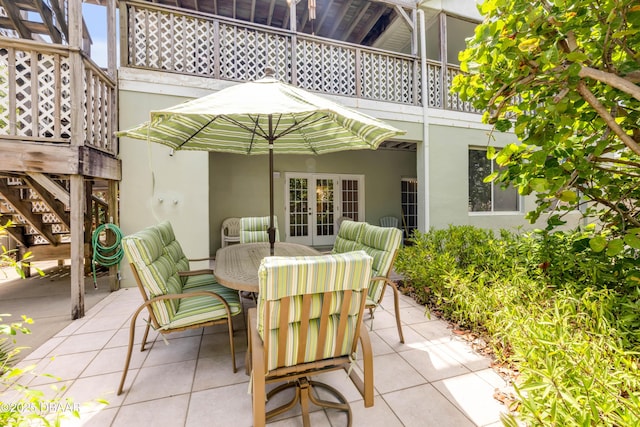 6361 Turtlemound Rd, New Smyrna Beach, FL 32169 - view of patio / terrace featuring french doors, stairs, and outdoor dining space