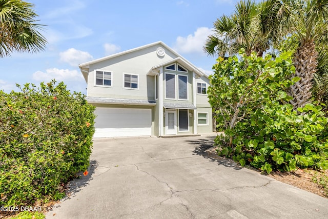 6361 Turtlemound Rd, New Smyrna Beach, FL 32169 - traditional home with a garage, stucco siding, and concrete driveway