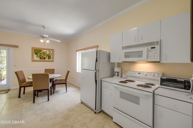 6361 Turtlemound Rd, New Smyrna Beach, FL 32169 - kitchen with ornamental molding, ceiling fan, a toaster, and white appliances