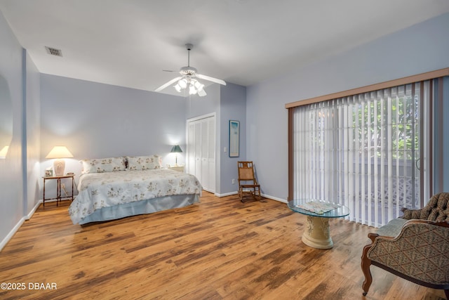 6361 Turtlemound Rd, New Smyrna Beach, FL 32169 - bedroom with visible vents, baseboards, wood finished floors, and a closet