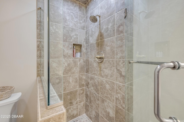 6361 Turtlemound Rd, New Smyrna Beach, FL 32169 - bathroom featuring a stall shower and toilet