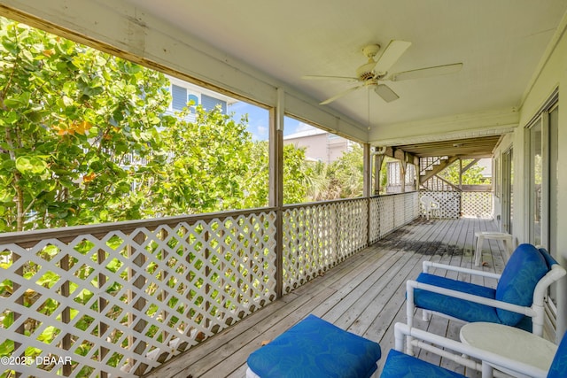 6361 Turtlemound Rd, New Smyrna Beach, FL 32169 - deck featuring a ceiling fan and stairway