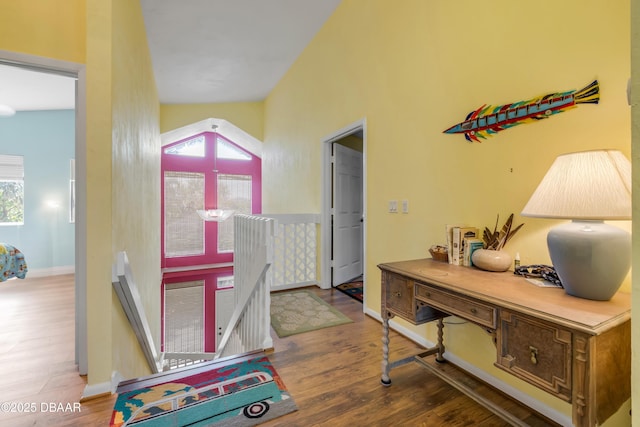 6361 Turtlemound Rd, New Smyrna Beach, FL 32169 - hallway featuring a wealth of natural light, wood finished floors, and an upstairs landing