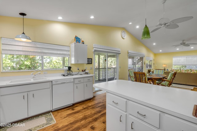 6361 Turtlemound Rd, New Smyrna Beach, FL 32169 - kitchen featuring white dishwasher, a ceiling fan, a sink, and a healthy amount of sunlight