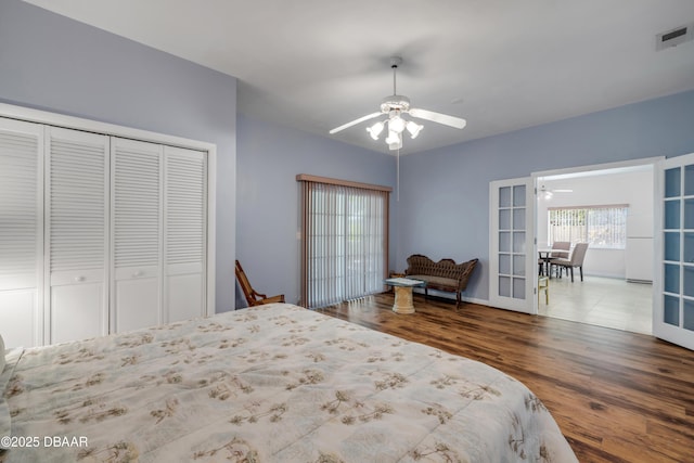6361 Turtlemound Rd, New Smyrna Beach, FL 32169 - bedroom featuring visible vents, a closet, wood finished floors, baseboards, and a ceiling fan