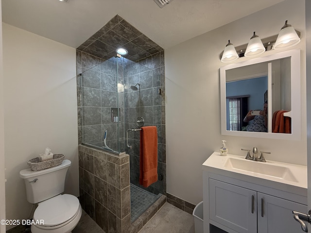 6361 Turtlemound Rd, New Smyrna Beach, FL 32169 - bathroom featuring vanity, tile patterned floors, a shower stall, and toilet