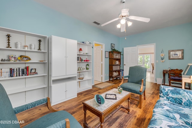 6361 Turtlemound Rd, New Smyrna Beach, FL 32169 - living room featuring ceiling fan, visible vents, and light wood-style flooring