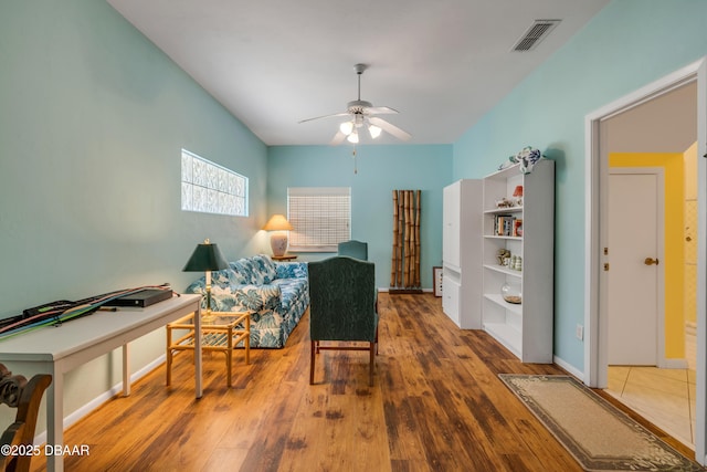 6361 Turtlemound Rd, New Smyrna Beach, FL 32169 - sitting room featuring baseboards, ceiling fan, visible vents, and wood finished floors