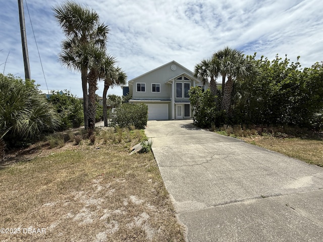 6361 Turtlemound Rd, New Smyrna Beach, FL 32169 - view of front of property featuring an attached garage and driveway