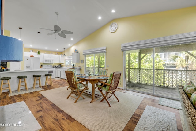 6361 Turtlemound Rd, New Smyrna Beach, FL 32169 - dining room with high vaulted ceiling, ceiling fan, light wood-type flooring, and recessed lighting