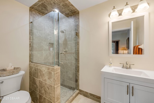 6361 Turtlemound Rd, New Smyrna Beach, FL 32169 - bathroom with vanity, toilet, tile patterned flooring, and a stall shower