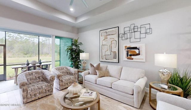 living room with light hardwood / wood-style flooring and ceiling fan