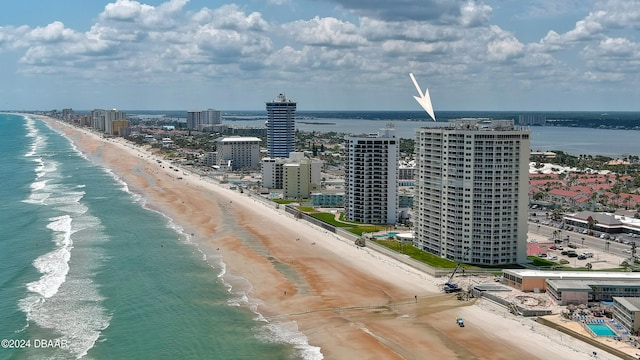 aerial view featuring a view of the beach and a water view