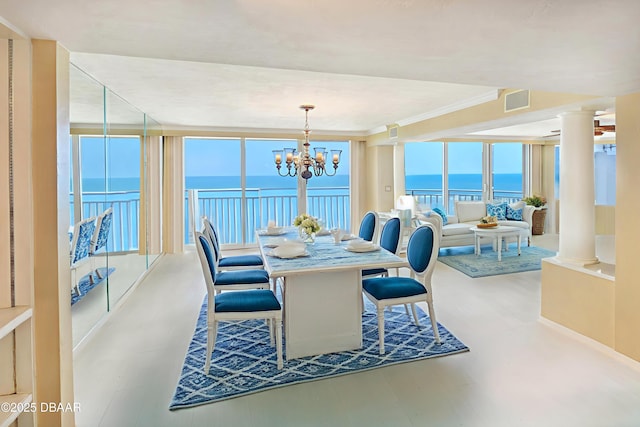 2545 S Atlantic Ave Unit 2107 2108, Daytona Beach Shores, FL 32118 - dining room with decorative columns, a water view, a chandelier, and ornamental molding