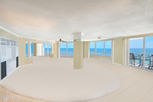 2545 S Atlantic Ave Unit 2107 2108, Daytona Beach Shores, FL 32118 - unfurnished room featuring a water view, ceiling fan, crown molding, floor to ceiling windows, and tile patterned flooring