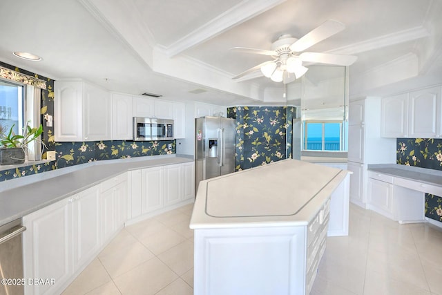 2545 S Atlantic Ave Unit 2107 2108, Daytona Beach Shores, FL 32118 - kitchen with stainless steel appliances, a tray ceiling, a center island, white cabinetry, and ceiling fan