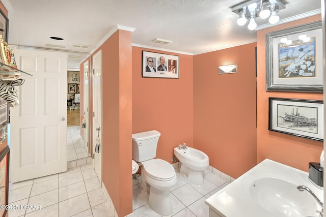 2545 S Atlantic Ave Unit 2107 2108, Daytona Beach Shores, FL 32118 - bathroom with toilet, a bidet, crown molding, tile patterned floors, and vanity