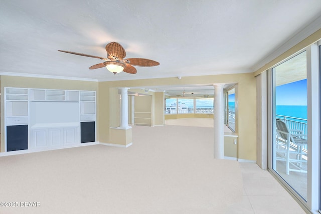 2545 S Atlantic Ave Unit 2107 2108, Daytona Beach Shores, FL 32118 - spare room featuring ornate columns, crown molding, ceiling fan, light carpet, and baseboards