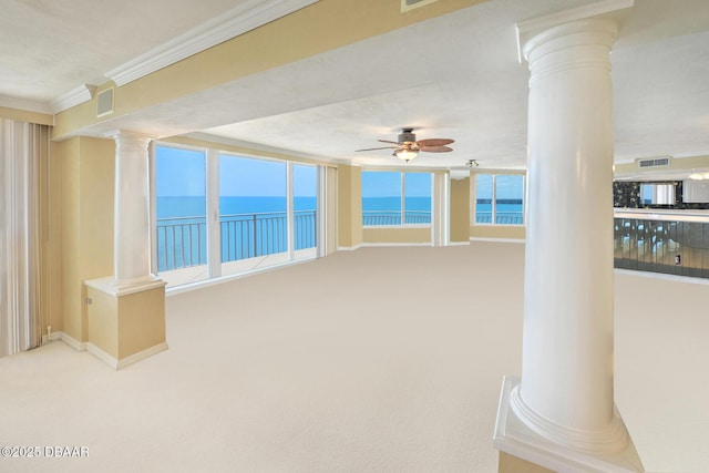 2545 S Atlantic Ave Unit 2107 2108, Daytona Beach Shores, FL 32118 - empty room with ornate columns, ornamental molding, a water view, a ceiling fan, and carpet floors