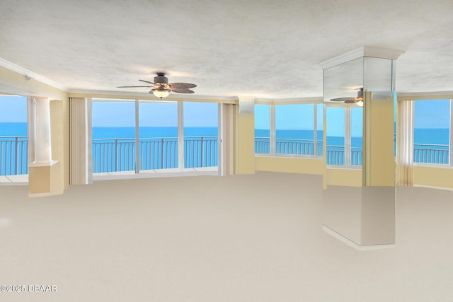 2545 S Atlantic Ave Unit 2107 2108, Daytona Beach Shores, FL 32118 - spare room with ceiling fan, a water view, and crown molding