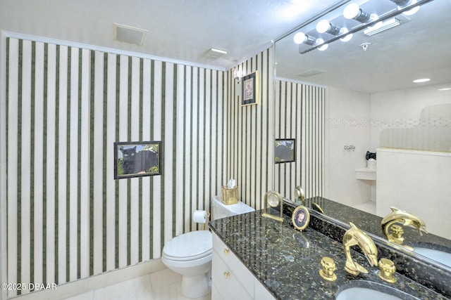 2545 S Atlantic Ave Unit 2107 2108, Daytona Beach Shores, FL 32118 - bathroom featuring toilet, vanity, and tile patterned flooring