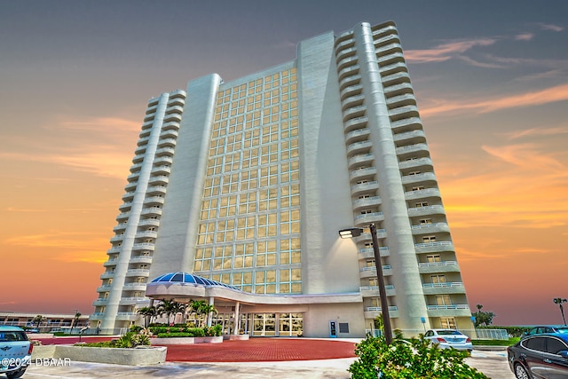 view of outdoor building at dusk