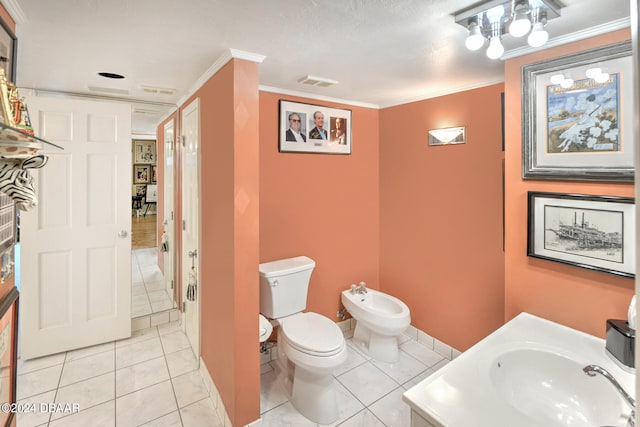 bathroom with tile patterned flooring, a bidet, crown molding, and vanity