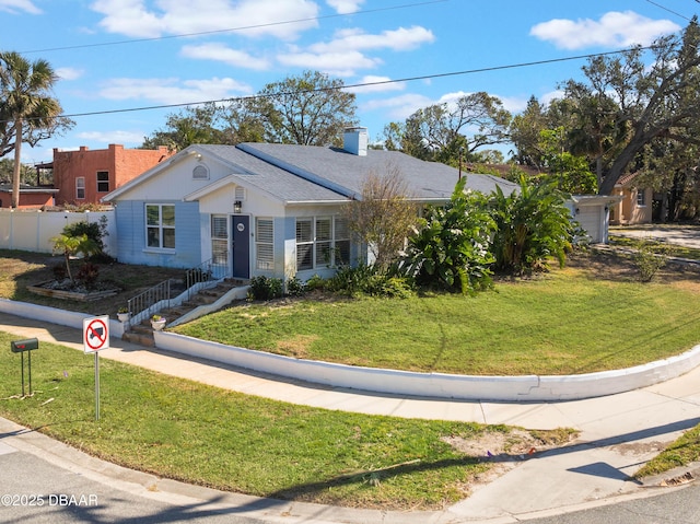 ranch-style house with a chimney, a front yard, and fence