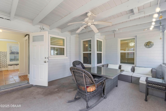 view of patio / terrace with a ceiling fan, outdoor dining space, and an outdoor hangout area