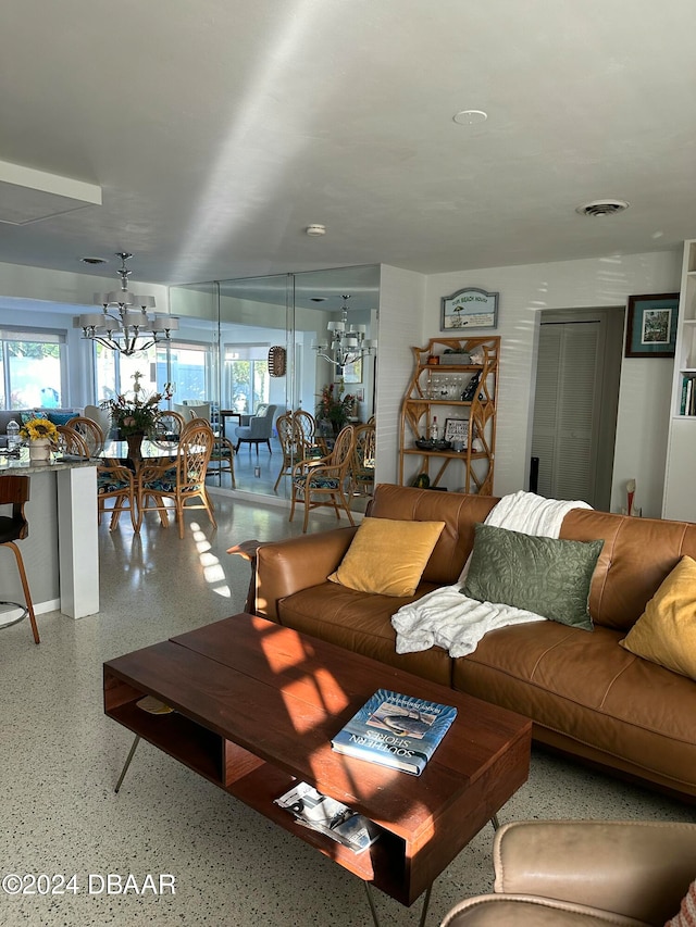 living room featuring an inviting chandelier