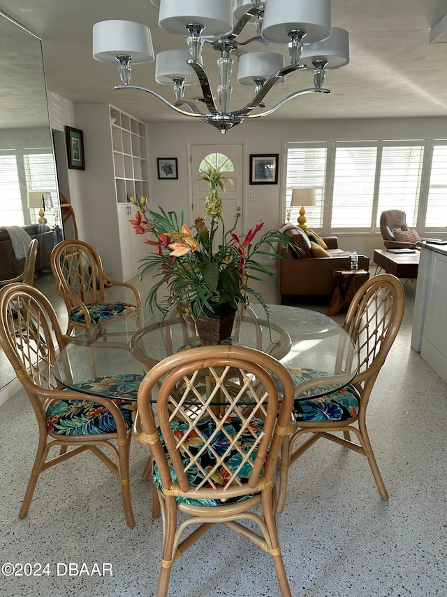 dining space featuring a chandelier