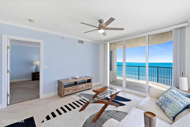 3315 S Atlantic Ave Unit 408, Daytona Beach Shores, FL 32118 - living room with a water view, expansive windows, a ceiling fan, light colored carpet, and crown molding