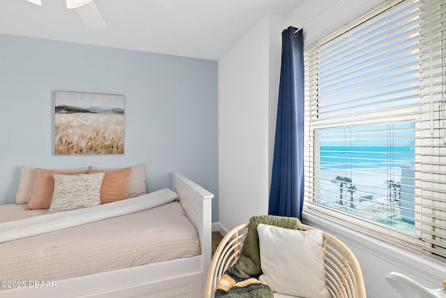 3315 S Atlantic Ave Unit 408, Daytona Beach Shores, FL 32118 - bedroom with baseboards and a ceiling fan