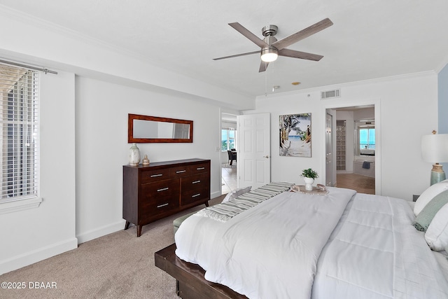 3315 S Atlantic Ave Unit 408, Daytona Beach Shores, FL 32118 - bedroom with crown molding, light carpet, multiple windows, ceiling fan, and ensuite bath