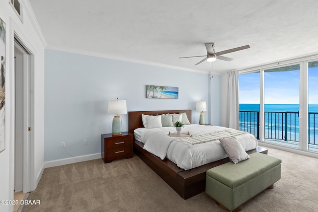 3315 S Atlantic Ave Unit 408, Daytona Beach Shores, FL 32118 - bedroom featuring access to exterior, light carpet, ornamental molding, a water view, and ceiling fan
