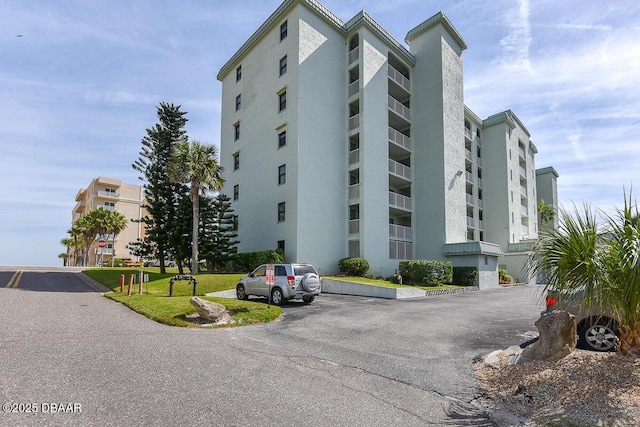 view of property featuring uncovered parking