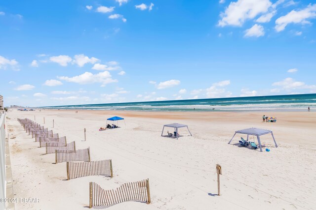 property view of water featuring a beach view